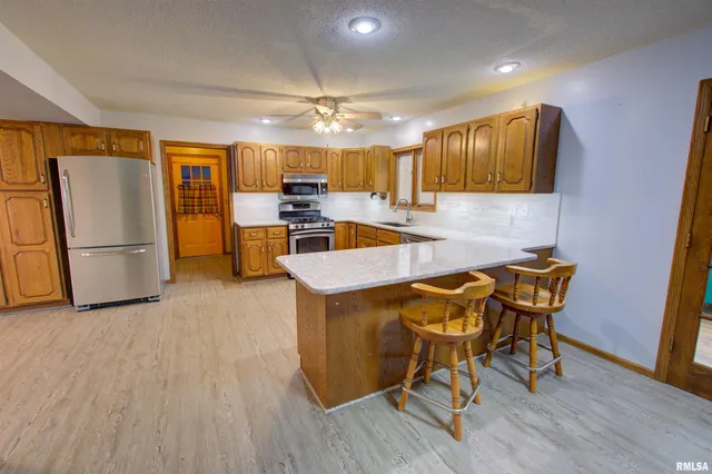 $300,000 | 591 Breezy Point Drive, Clinton, IA 52732