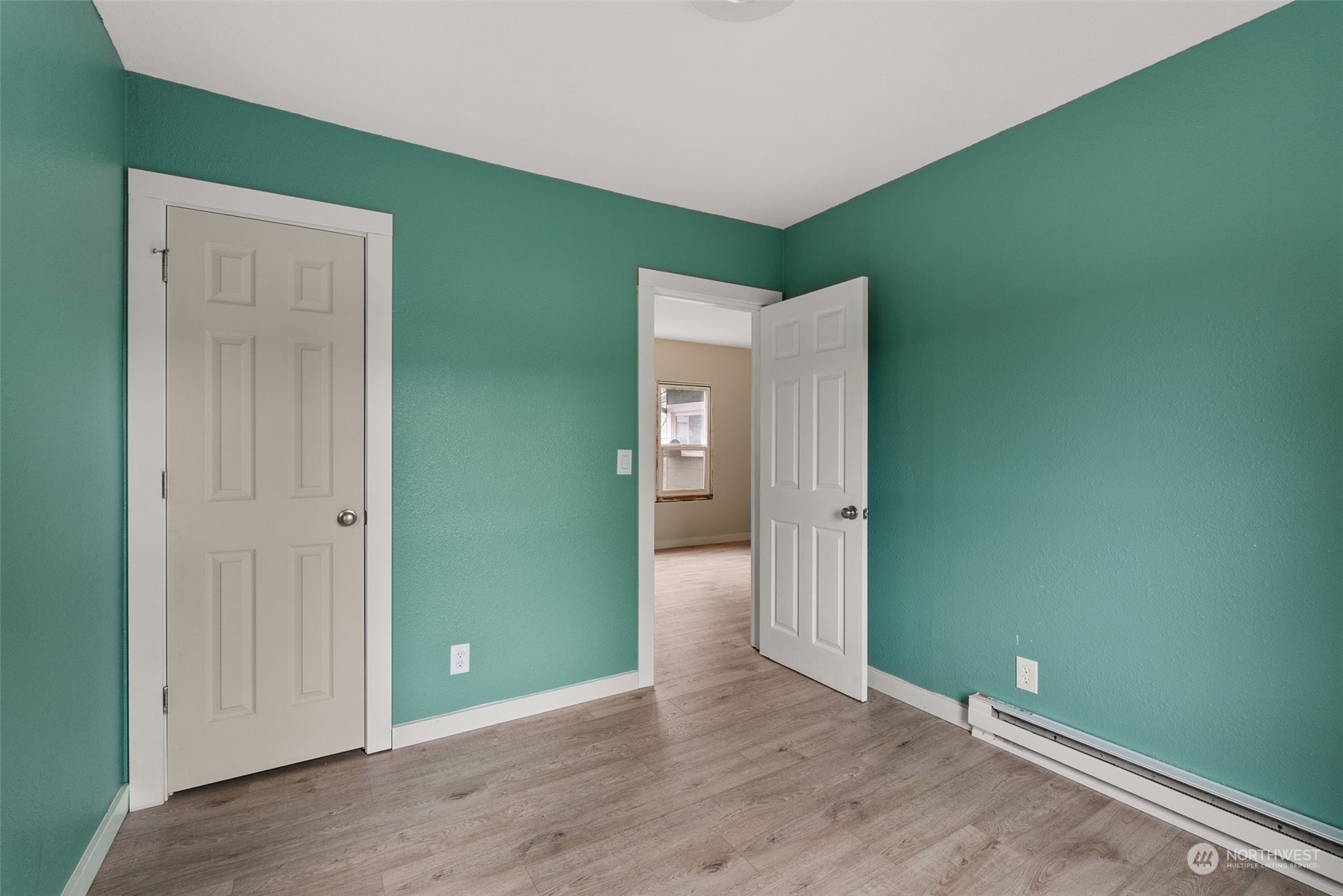 325 East Main Mossyrock, WA 98564 - Photo 12 of 24 an empty room with wooden floor and windows