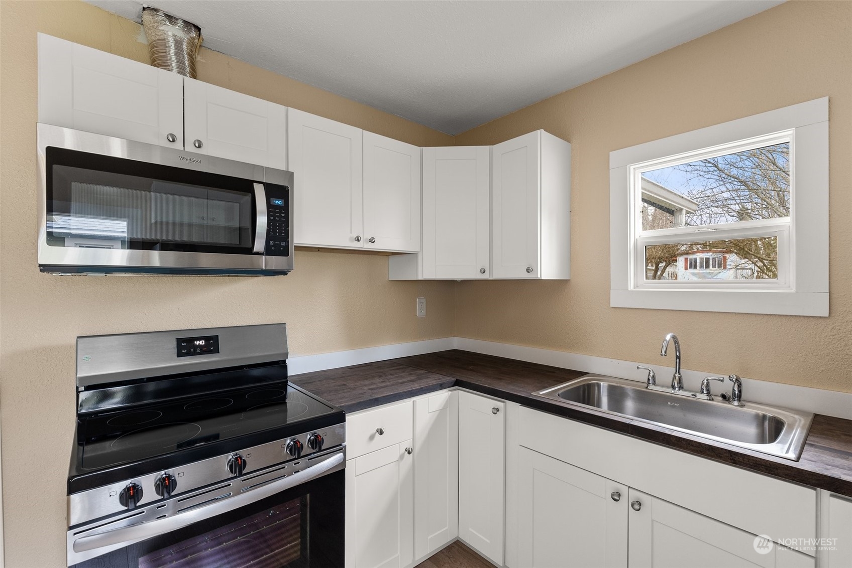 325 East Main Mossyrock, WA 98564 - Photo 2 of 24 a kitchen with stainless steel appliances a stove sink and cabinets