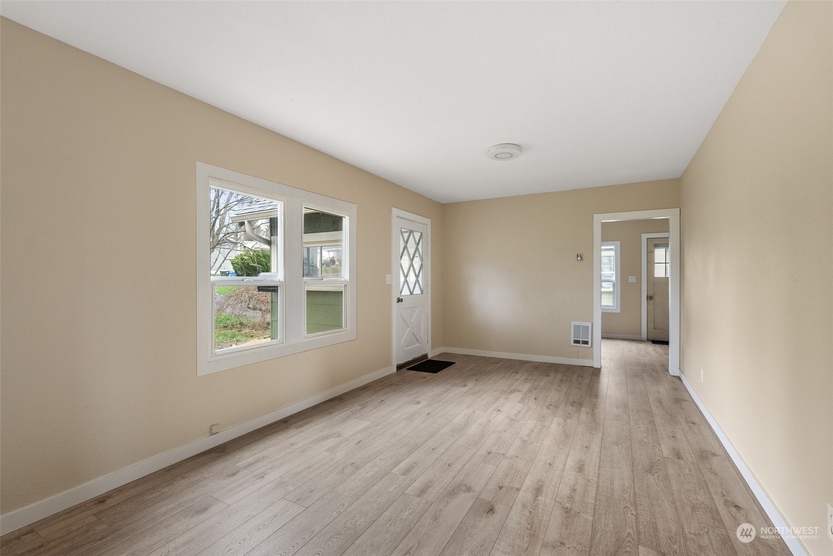 325 East Main Mossyrock, WA 98564 - Photo 7 of 24 an empty room with wooden floor and windows