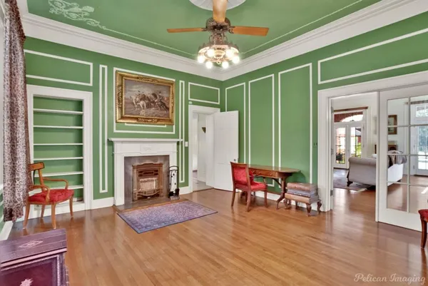 a living room with furniture and a fireplace