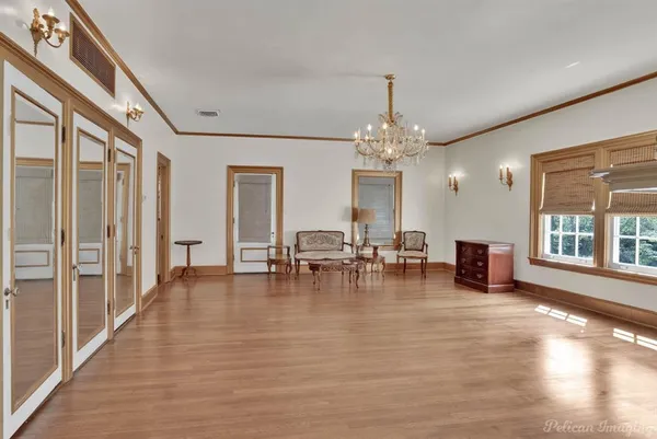 a view of a dining room with furniture and chandelier
