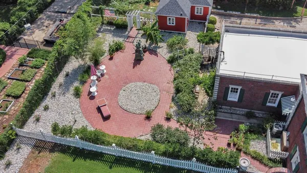 an aerial view of a house with swimming pool and outdoor space