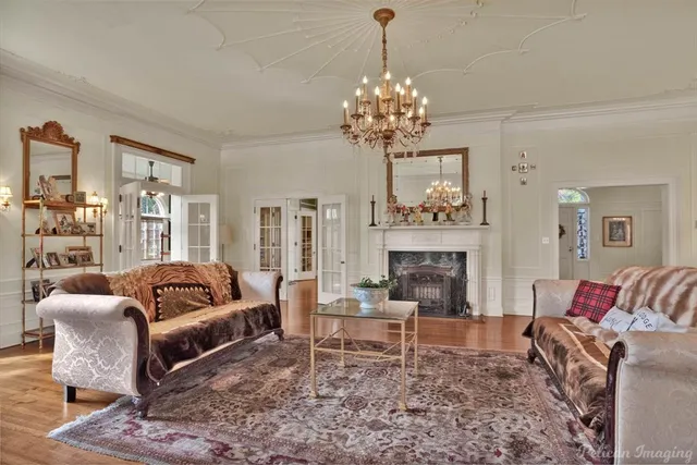 a living room with furniture and a fireplace