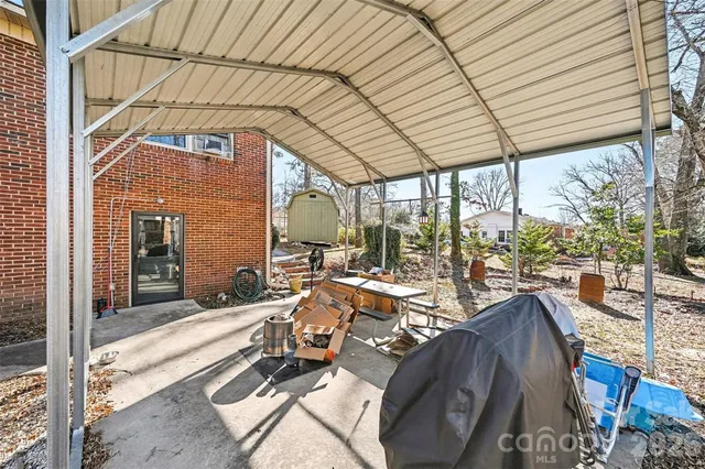 a view of balcony with couch and chairs