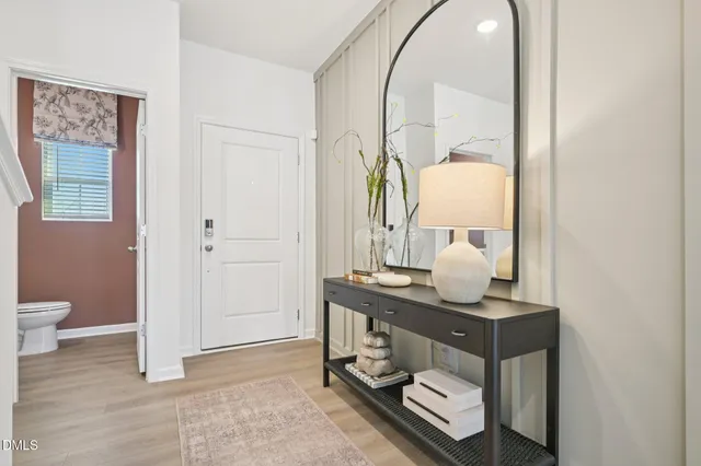 a bathroom with a sink mirror and toilet