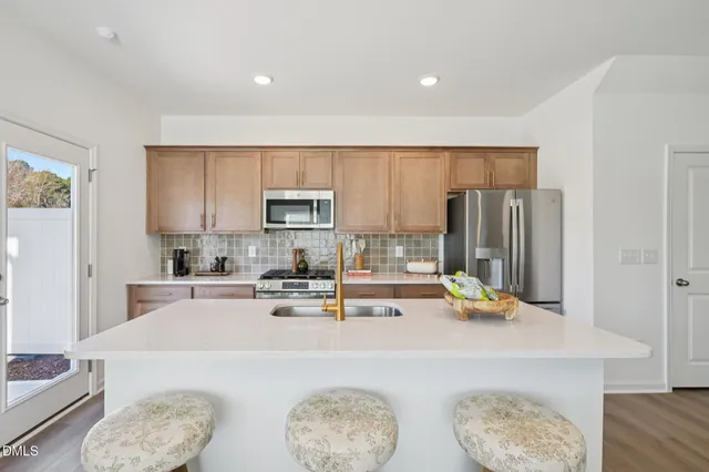 a spacious bedroom with a bed and a dresser