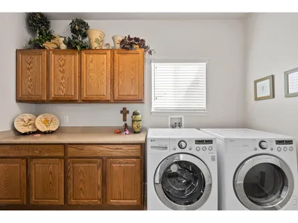 a utility room with closet dryer and washer