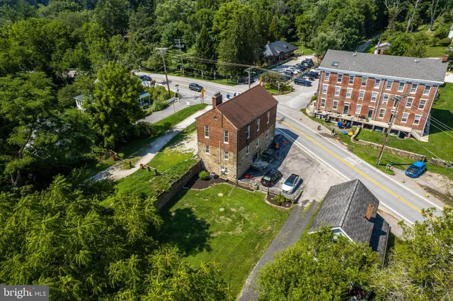 an aerial view of a house with a garden