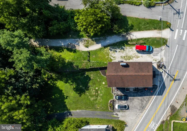 an aerial view of residential houses with outdoor space