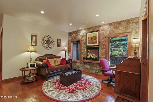 a living room with furniture and a fireplace