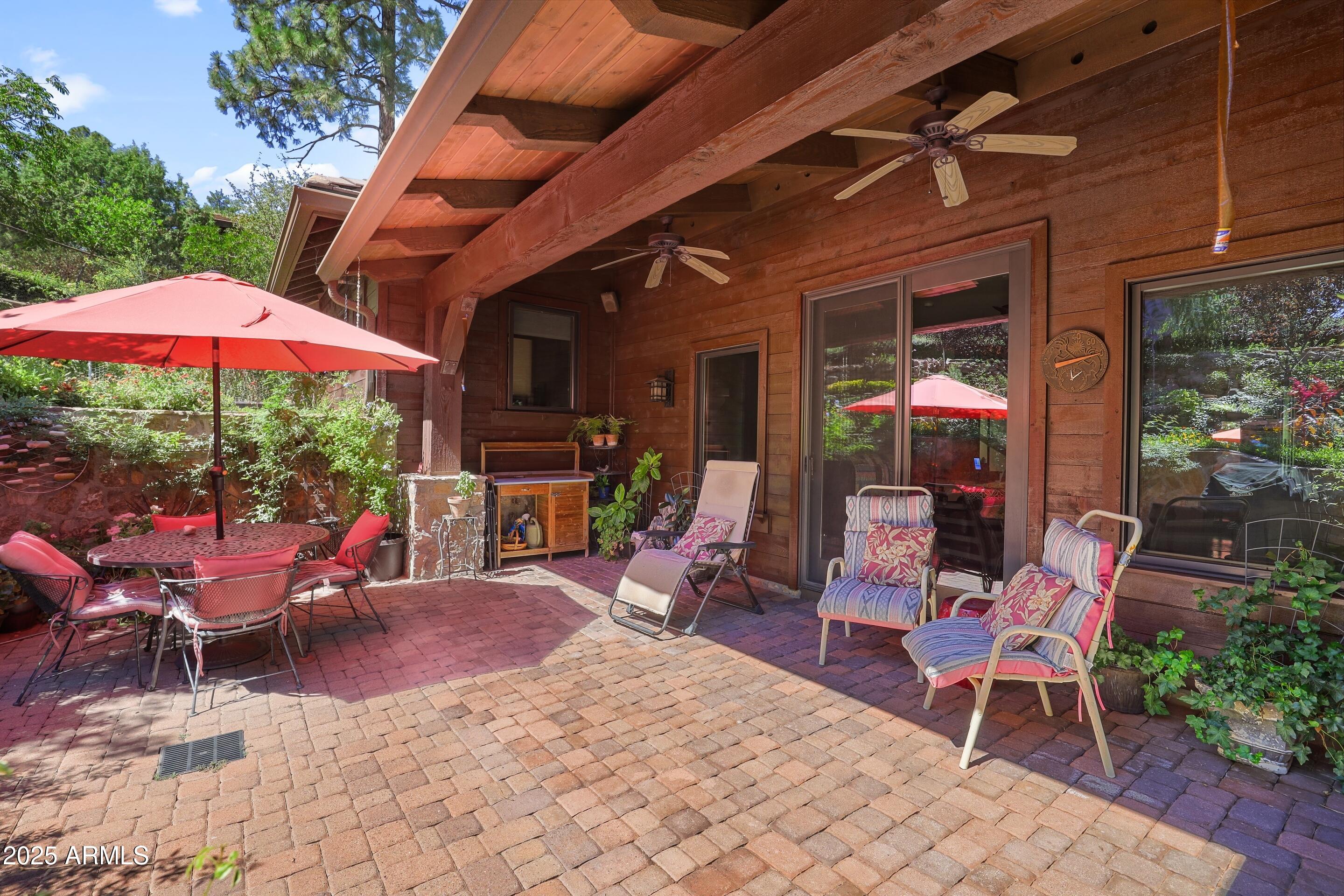 2307 East Grapevine Drive Payson, AZ 85541 - Photo 30 of 40 a view of a chairs and tables in the patio next to a yard