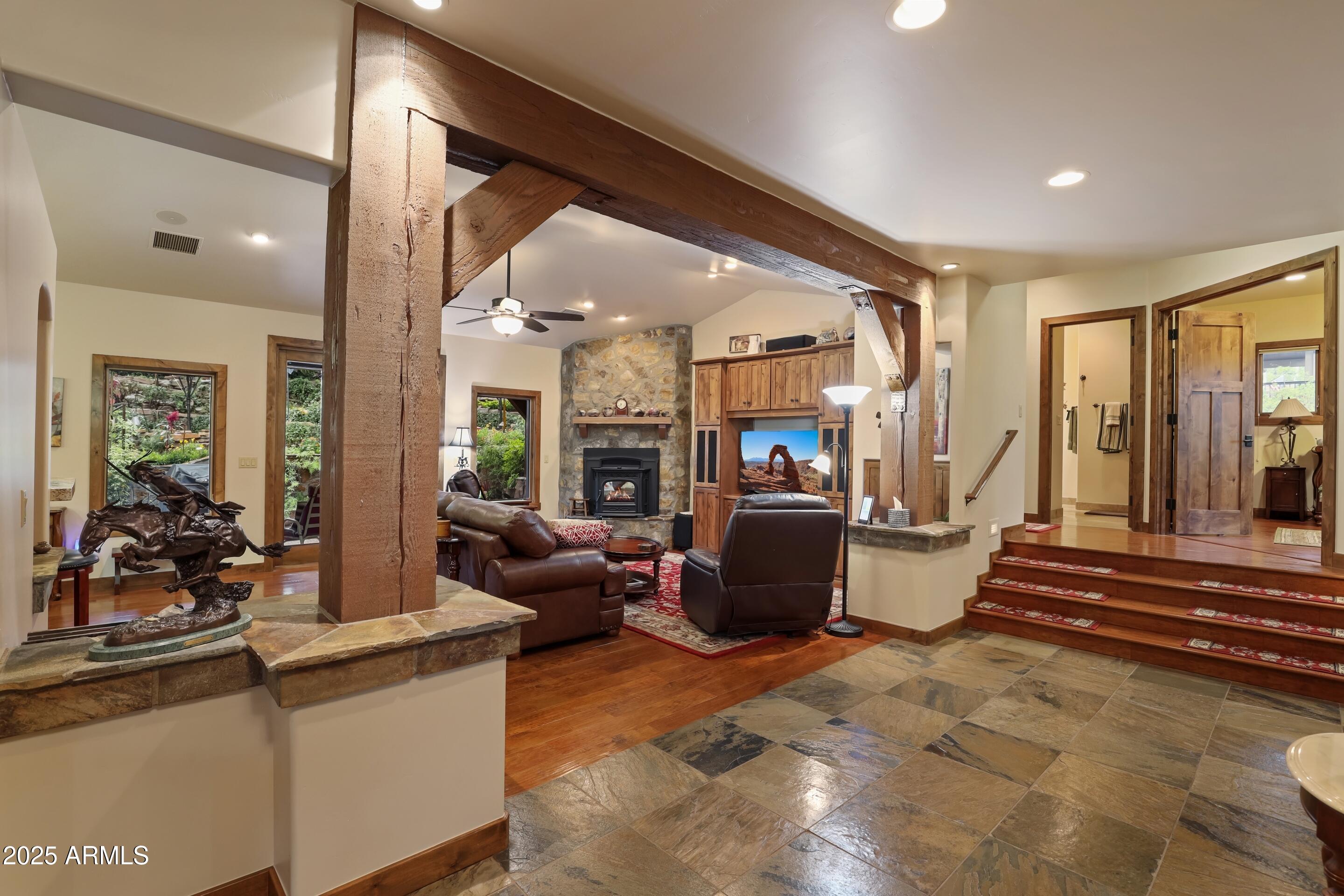 2307 East Grapevine Drive Payson, AZ 85541 - Photo 3 of 40 a living room with fireplace furniture and a large window