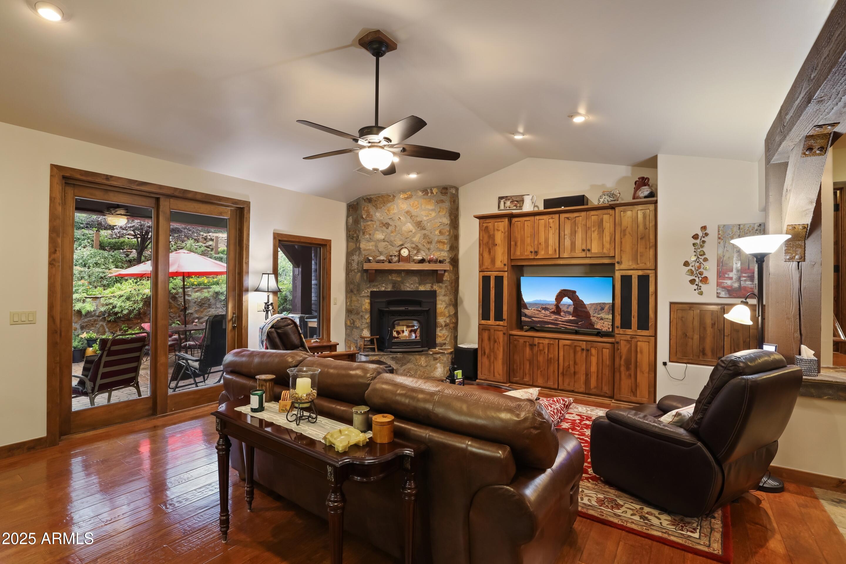 2307 East Grapevine Drive Payson, AZ 85541 - Photo 4 of 40 a living room with furniture a fireplace and a flat screen tv