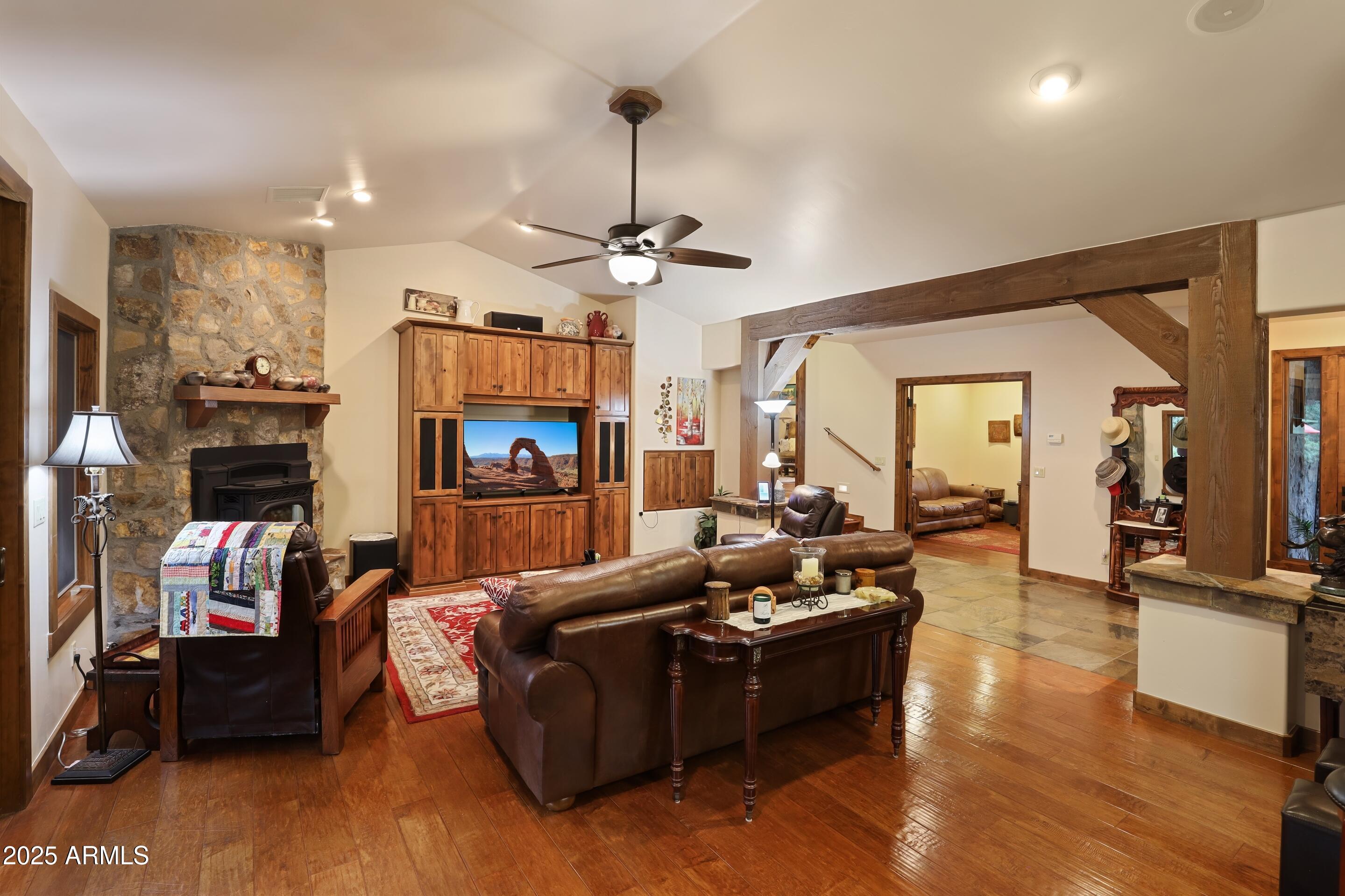 2307 East Grapevine Drive Payson, AZ 85541 - Photo 5 of 40 a living room with furniture and a fireplace