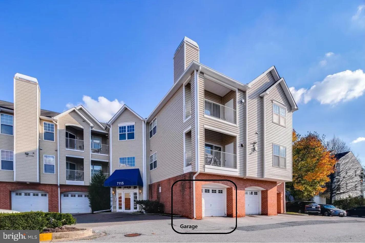 7115 Sandown Circle, Unit 202 Windsor Mill, MD 21244 - Photo 1 of 60 a front view of a building with street view