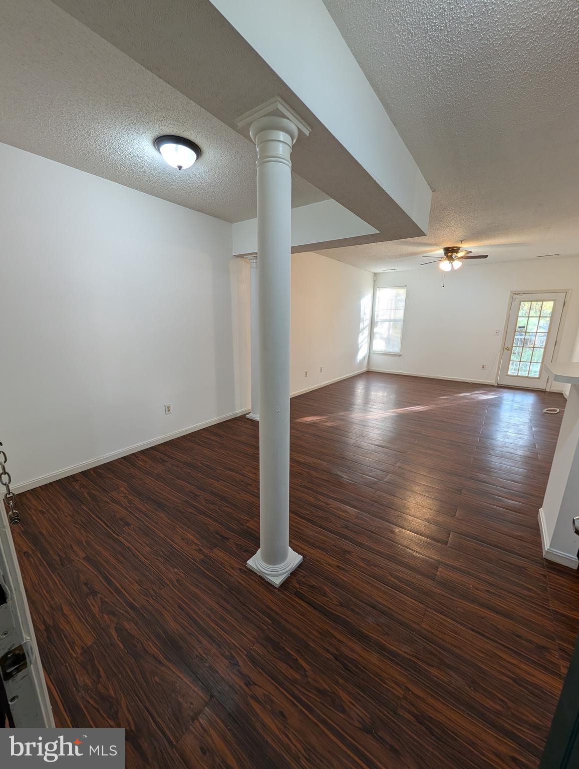 7115 Sandown Circle, Unit 202 Windsor Mill, MD 21244 - Photo 2 of 60 a view of empty room with wooden floor