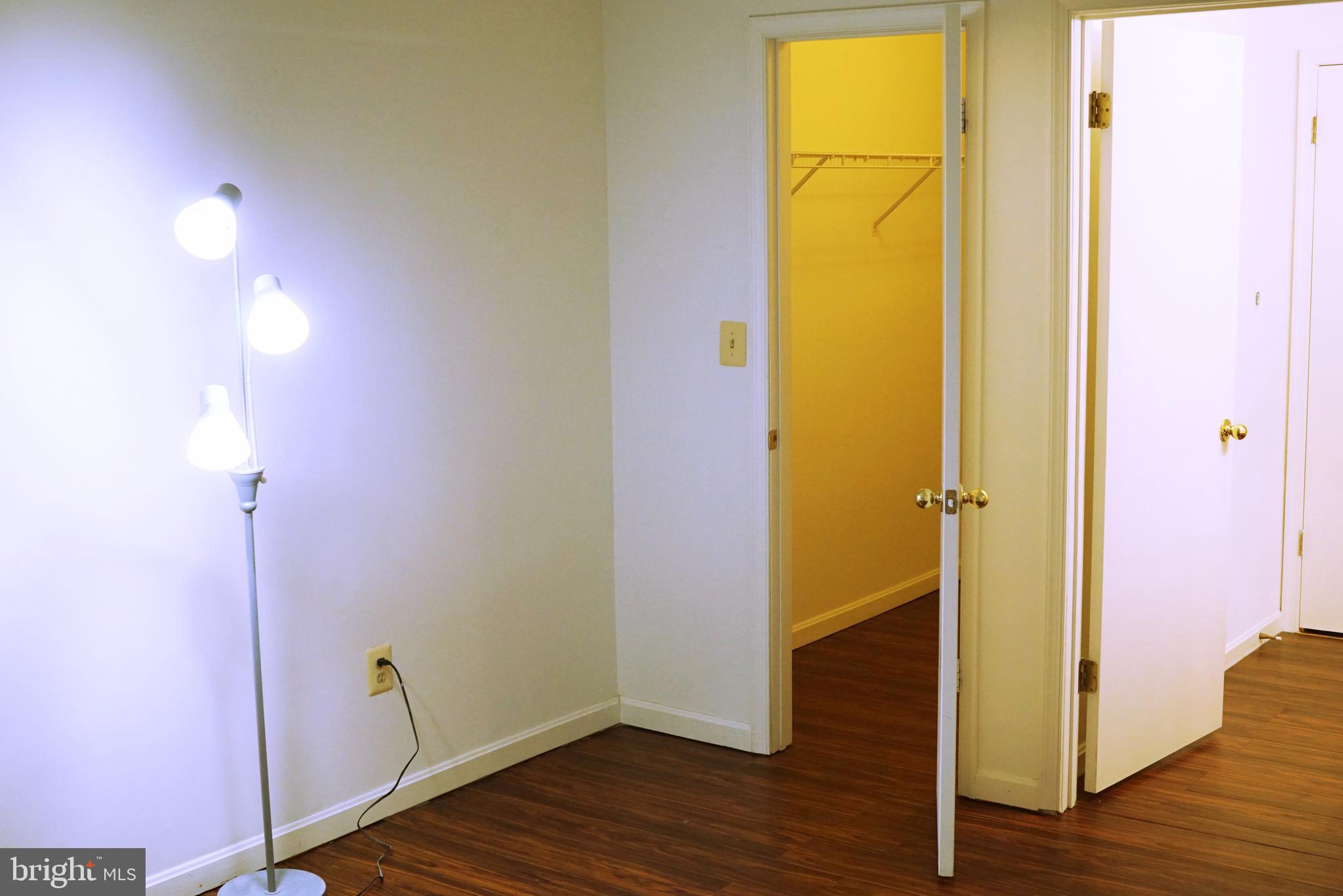 7115 Sandown Circle, Unit 202 Windsor Mill, MD 21244 - Photo 25 of 60 a view of empty room with wooden floor