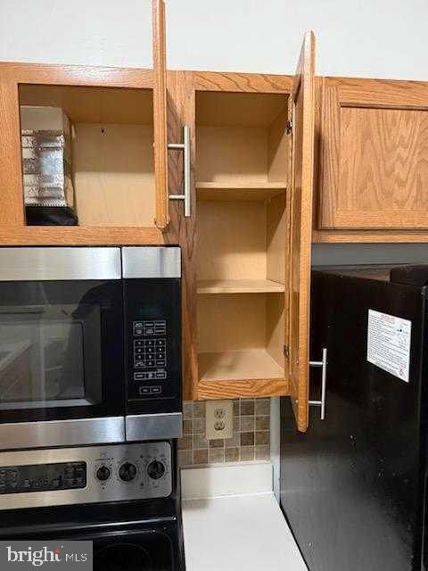 7115 Sandown Circle, Unit 202 Windsor Mill, MD 21244 - Photo 36 of 60 a close view of a stove top oven sitting inside of a room