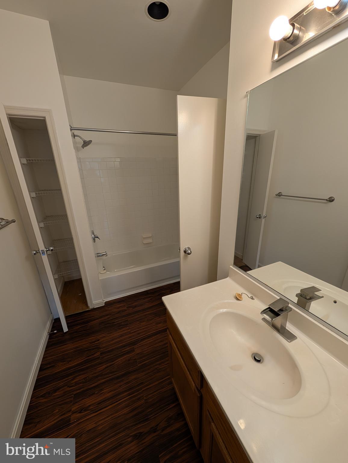 7115 Sandown Circle, Unit 202 Windsor Mill, MD 21244 - Photo 53 of 60 a bathroom with a sink and mirror