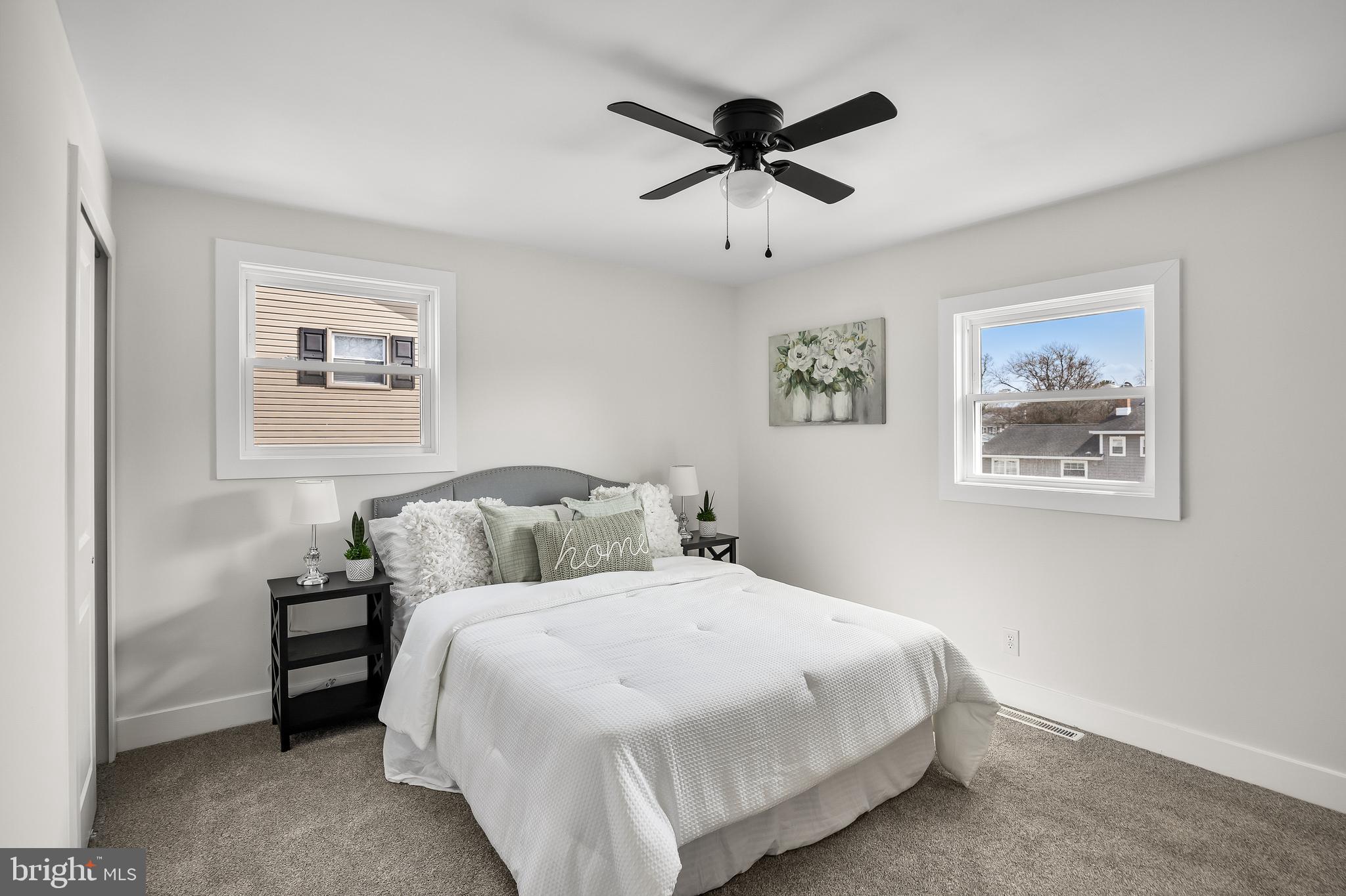 10 Cobblestone Road Cherry Hill, NJ 08003 - Photo 11 of 15 a bedroom with a large bed and a painting on the wall