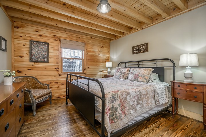 995 Dale Ridge Road Dowelltown, TN 37059 - Photo 12 of 45 a bedroom with a bed and wooden floor