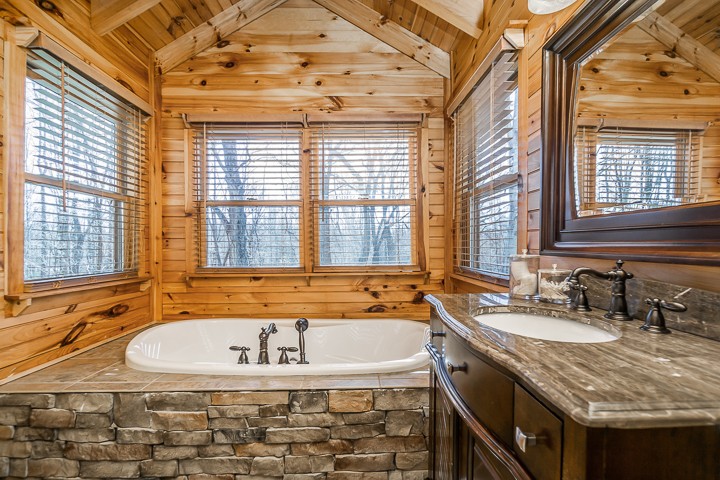 995 Dale Ridge Road Dowelltown, TN 37059 - Photo 13 of 45 a bathroom with a granite countertop tub and a sink