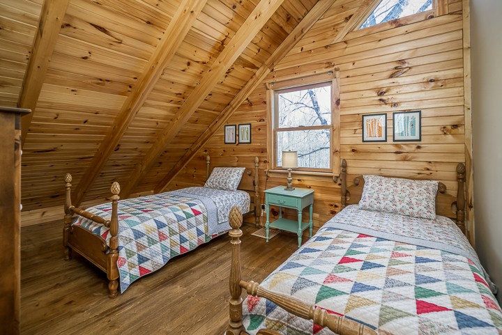 995 Dale Ridge Road Dowelltown, TN 37059 - Photo 19 of 45 a bedroom with a bed and wooden floor