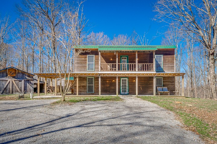995 Dale Ridge Road Dowelltown, TN 37059 - Photo 23 of 45 front view of a building with a garden