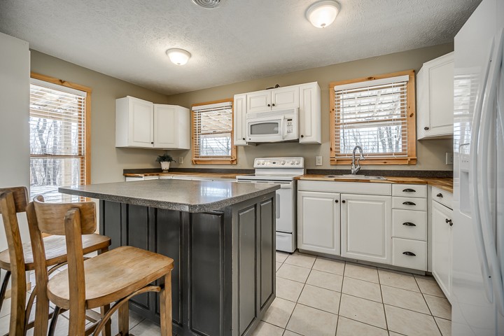 995 Dale Ridge Road Dowelltown, TN 37059 - Photo 27 of 45 a kitchen with a sink stove and cabinets