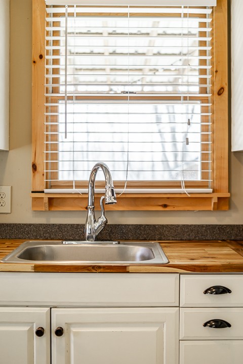 995 Dale Ridge Road Dowelltown, TN 37059 - Photo 28 of 45 a bathroom with a granite countertop sink and a window