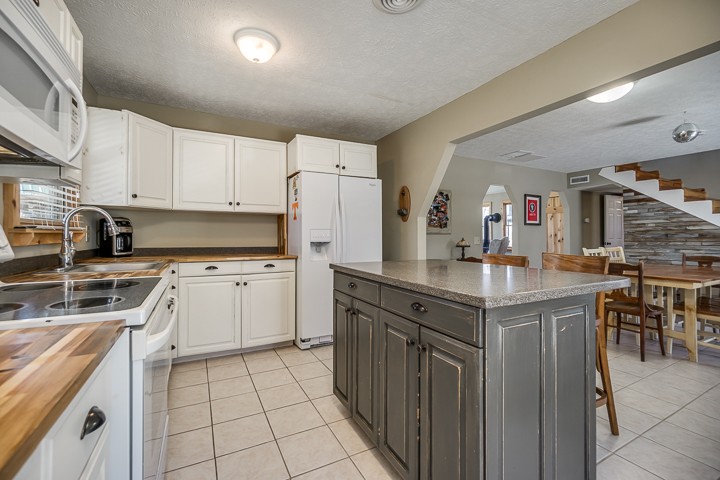 995 Dale Ridge Road Dowelltown, TN 37059 - Photo 29 of 45 a kitchen with a sink window and cabinets