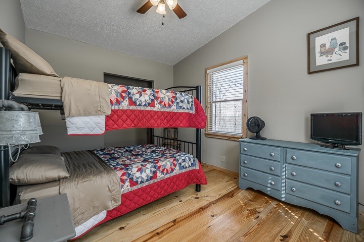 995 Dale Ridge Road Dowelltown, TN 37059 - Photo 38 of 45 a bedroom with a bed and wooden floor