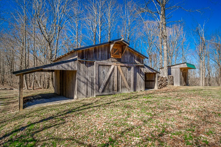 995 Dale Ridge Road Dowelltown, TN 37059 - Photo 42 of 45 a house with trees in front of it