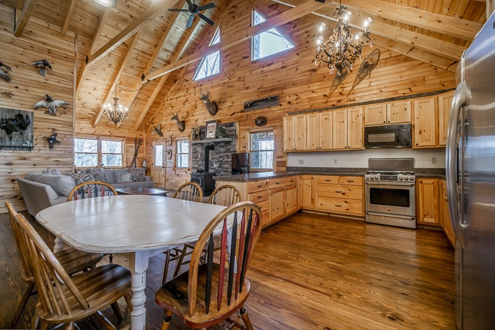 995 Dale Ridge Road Dowelltown, TN 37059 - Photo 8 of 45 a kitchen with stainless steel appliances granite countertop a kitchen island a stove a table and chairs