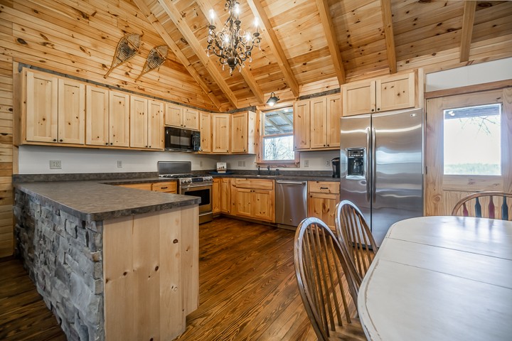 995 Dale Ridge Road Dowelltown, TN 37059 - Photo 9 of 45 a kitchen with stainless steel appliances granite countertop a stove a sink a microwave and a refrigerator