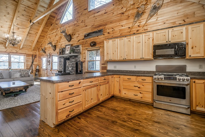 995 Dale Ridge Road Dowelltown, TN 37059 - Photo 10 of 45 a kitchen with stainless steel appliances granite countertop a stove a sink and a white cabinets