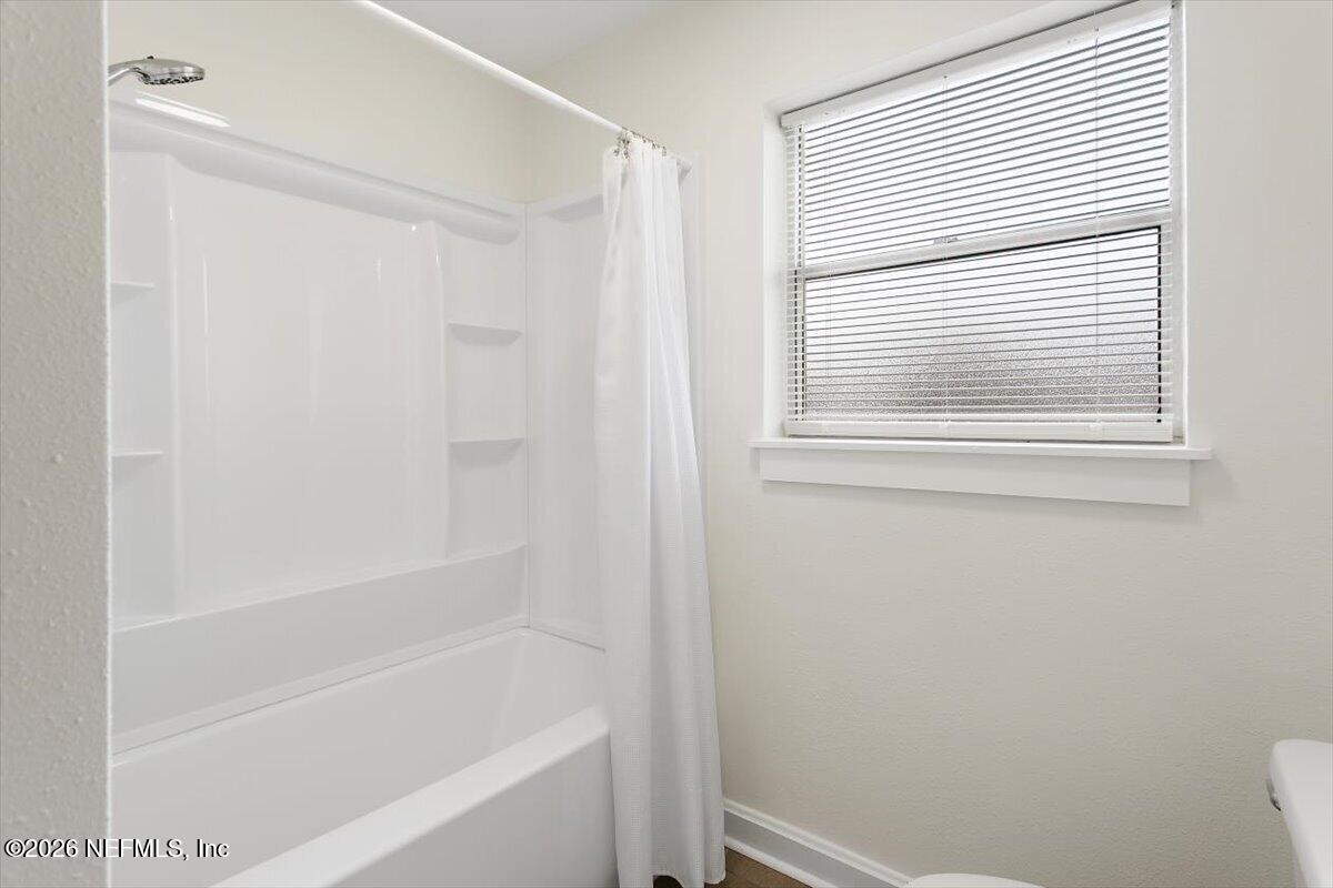 103 Coronado Street St. Augustine, FL 32080 - Photo 18 of 25 a close up of a bathtub curtain