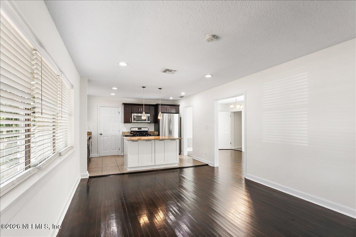 103 Coronado Street St. Augustine, FL 32080 - Photo 5 of 25 a view of a kitchen with a sink and a stove top oven