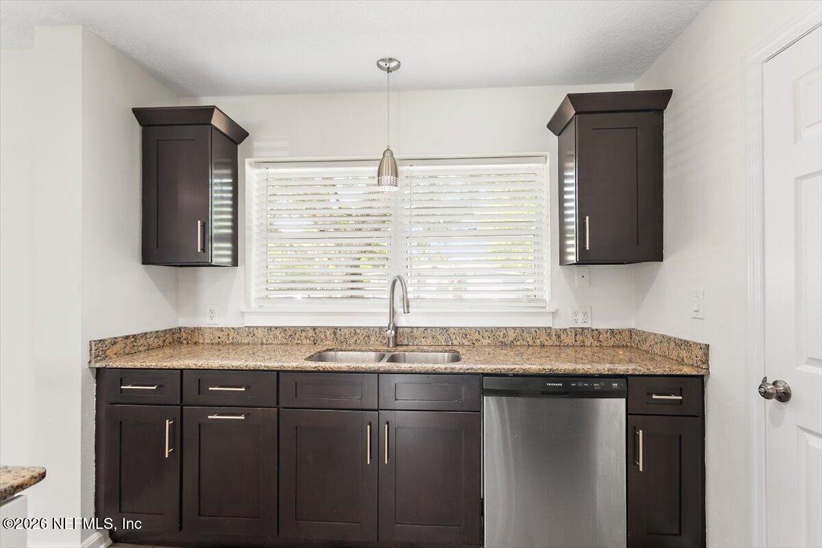 103 Coronado Street St. Augustine, FL 32080 - Photo 7 of 25 a bathroom with a granite countertop sink a mirror and