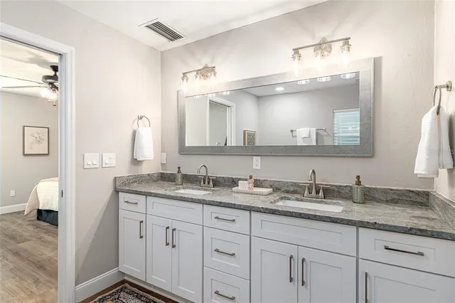 a view of a house with a large window and yard