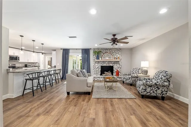 a living room with furniture and a fireplace