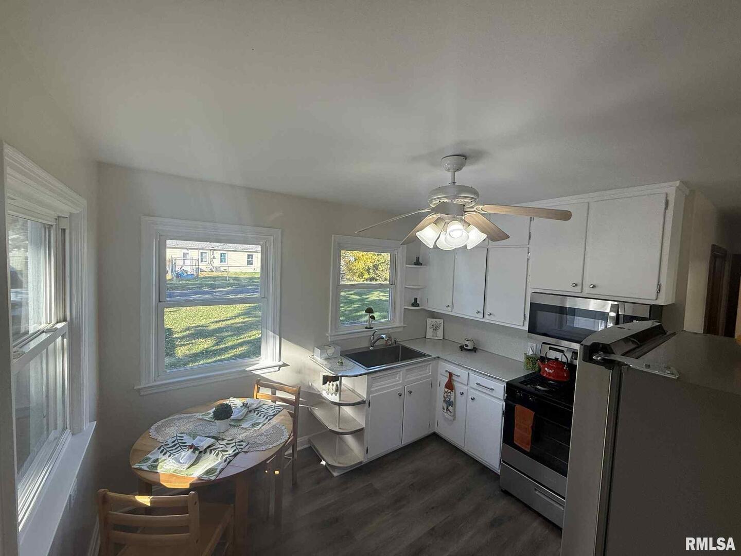 3 Anderson Avenue Milan, IL 61264 - Photo 12 of 30 a kitchen that has a sink stove and cabinets
