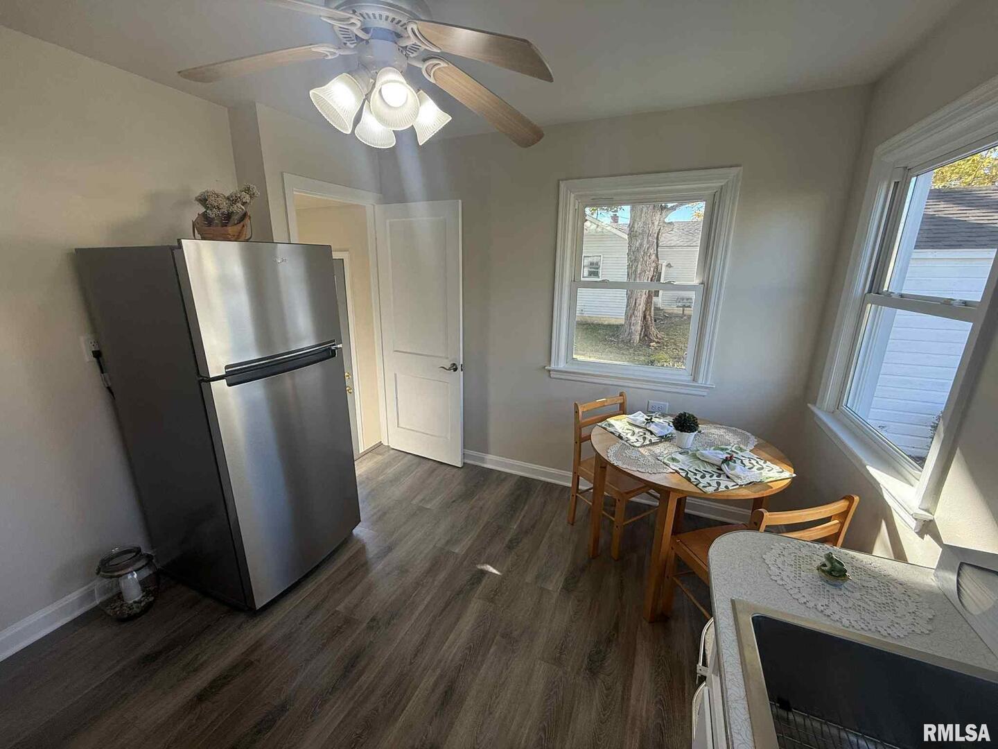 3 Anderson Avenue Milan, IL 61264 - Photo 13 of 30 a kitchen with stainless steel appliances granite countertop a refrigerator a stove and a wooden floors