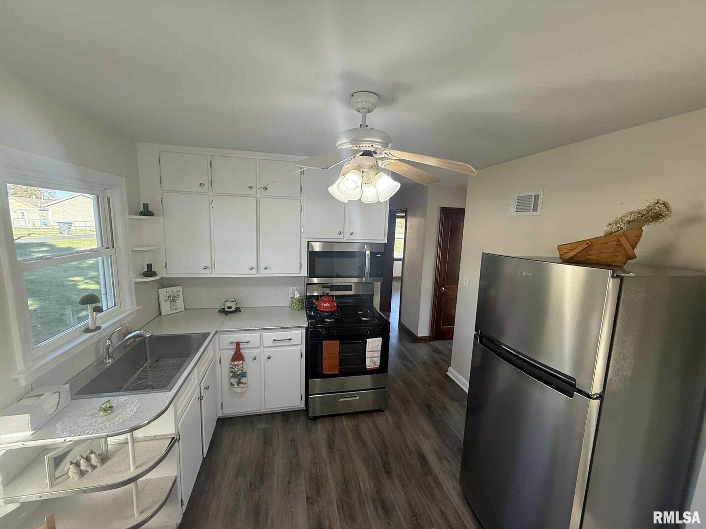 3 Anderson Avenue Milan, IL 61264 - Photo 14 of 30 a kitchen with a refrigerator a sink and dishwasher