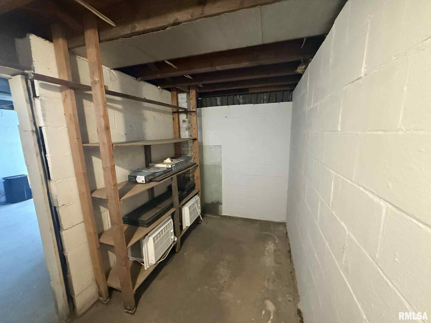 3 Anderson Avenue Milan, IL 61264 - Photo 26 of 30 a view of walk in closet with clothes and shoes