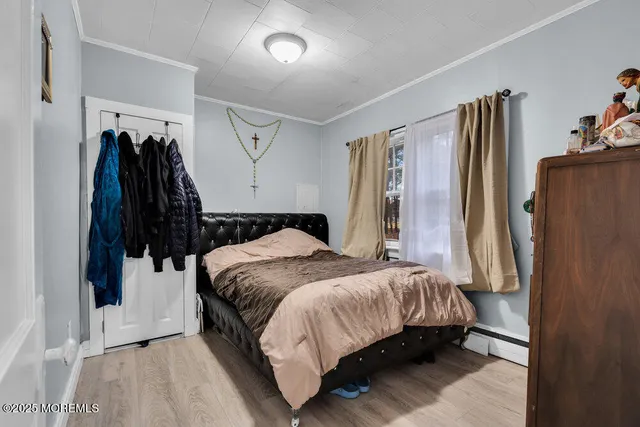 a bedroom with a bed and a walk in closet