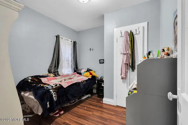 a bedroom with a bed and a closet