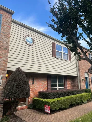 a front view of a house with garage