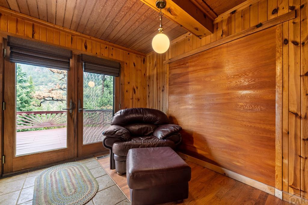 9600 Middle Creek Canyon Road Beulah, CO 81023 - Photo 17 of 50 a living room with furniture and a large window